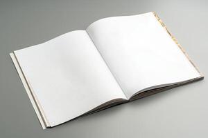 A blank open notebook resting on a neutral background during daylight photo