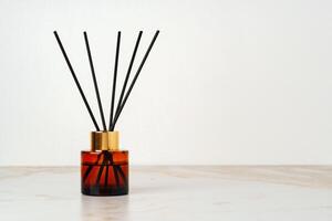 Black Reed Diffuser Bottle on Marble Tabletop photo