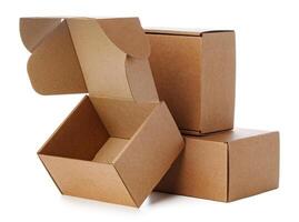 Stacked brown cardboard boxes in various sizes arranged on a white background photo