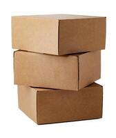 Stacked brown cardboard boxes in various sizes arranged on a white background photo
