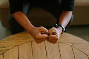 Close-up of a clenched fist, symbolizing strength, determination, or defiance photo