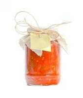 Canned vegetables in glass jars isolated on white background photo