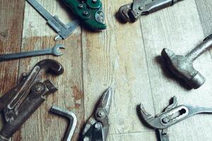 Working tools on wooden rustic background. top view photo