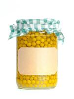 Canned vegetables in glass jars isolated on white background photo