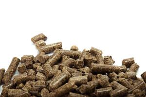 stack of wooden pellets for bio energy, white background, isolated photo
