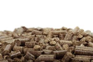 stack of wooden pellets for bio energy, white background, isolated photo