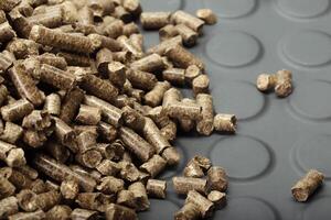Wood pellets in the background. photo