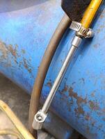 Close up of tire chuck when not in use to inflate vehicle tires photo