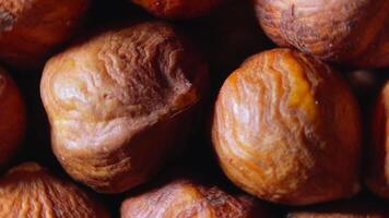 Scattered Peeled Hazelnuts - Top View, Rotating. Turning Hazelnut Background. Natural High-Calorie Snacks - Rotation video