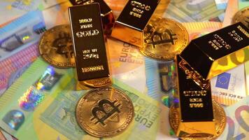 Fine Gold Bars with Bitcoin Coins on the Different Euro Banknotes Rotating. Euro Currency. Colored Paper Money. A Lot of Euro Cash. Income, Earnings, Cryptocurrency, Money Saving and Wealth Concept video