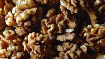 Scattered Shelled Walnuts - Top View, Rotating. Turning Walnut Background. Natural High-Calorie Snacks - Rotation video