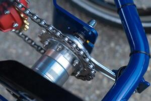 Rear axle of a bicycle with chain and gear. photo