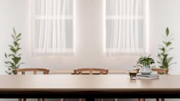 A close-up of a space for displaying products on a wooden dining table in a contemporary white room. photo