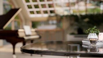 A table in a luxurious restaurant with a grand piano in the background. photo