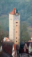 A tall tower with a clock on it photo
