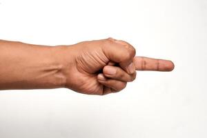 Hand pointing gesture. Index finger pointing. Hand of a Latino man. photo