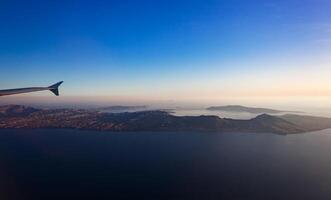Aerial view of Santorini island as seen from plane window photo