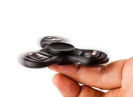 Palying with a Black Fidget Spinner photo