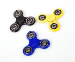 Three Fidget Spinner on white background photo