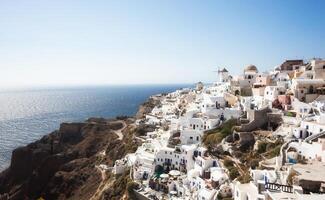 Oia village, Santorini, view with windmills photo