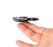 Palying with a Black Fidget Spinner photo