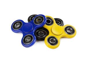 Three Fidget Spinner on white background photo