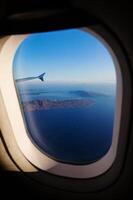 Aerial view of Santorini island as seen from plane window photo