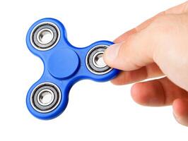 Playing with a blue Fidget Spinner photo