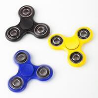 Three Fidget Spinner on white background photo