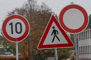 Speed limit, pedestrian crossing and no vehicles road signs showing traffic regulations photo
