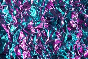 Crumpled iridescent metallic texture background photo