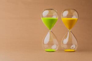 Hourglass, a timepiece, the rules of time and the rush of work, the value and meaning of time photo