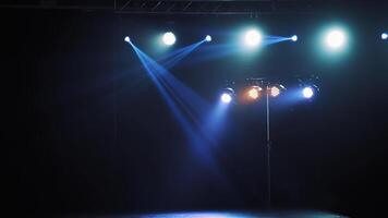 Beautiful view of flashing lights with different colors lightning from spotlights. Bright colors of projectors shining from top on the stage in the nightclub. video