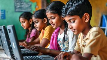 A group of children using laptops in a classroom video