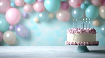 Pastel balloon garland surrounding a table with a birthday cake, leaving a soft background with space for text. photo