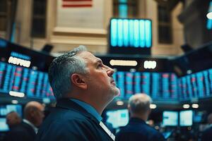 Traders engage with stock market data and monitor transactions on the exchange floor photo