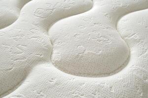 Close up view of white mattresses arranged neatly for customer inspection. photo