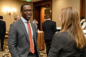 Two professionals engage in conversation at a networking event focused on business growth photo