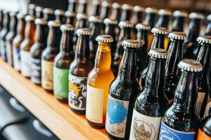 Close ups of distinctive beer labels from local breweries on a tasting table photo