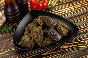 Stuffed dolma - meat in grape leaves photo