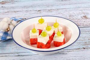 Watermelon with feta and grape photo