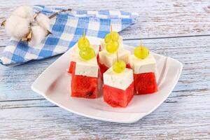 Watermelon with feta and grape photo