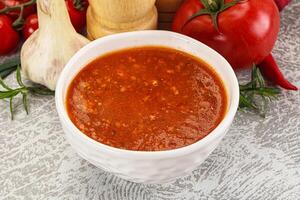 Hot tomato soup with diced chicken photo