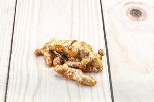 Fresh young Tumeric root heap photo