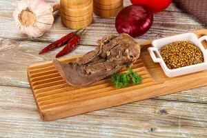 Steamed pork tongue with mustard photo