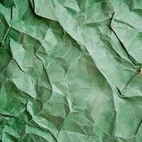 crumpled green paper texture background photo