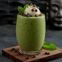 Refreshing green smoothie with ice cream and chocolate chips photo
