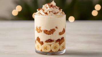 Delicious banana pudding dessert with whipped cream and crumbled cookies photo