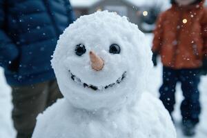 Cute snowman with big black eyes and a carrot nose photo