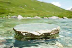 Serene mountain lake with smooth rock in foreground photo